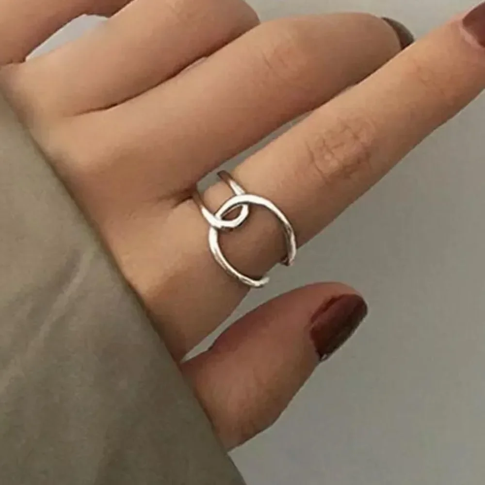The Loop Ring in 925 silver adjustable sizing.
